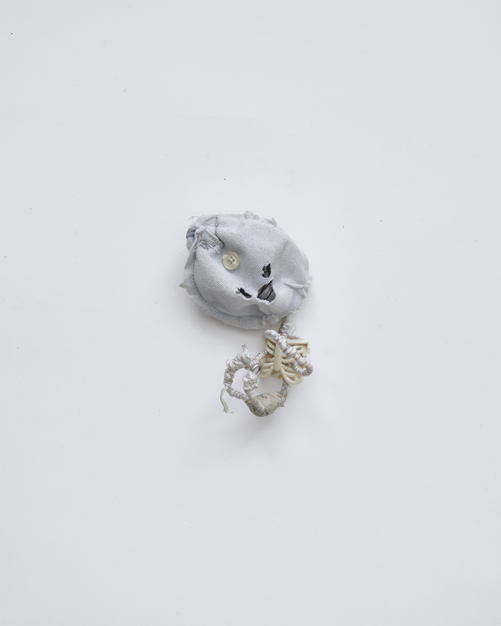 Flower 19, 2026, Wire, cord, thread, pigment, fabric, found objects, dolls, miniatures, 7.5x10.5x6.5cm