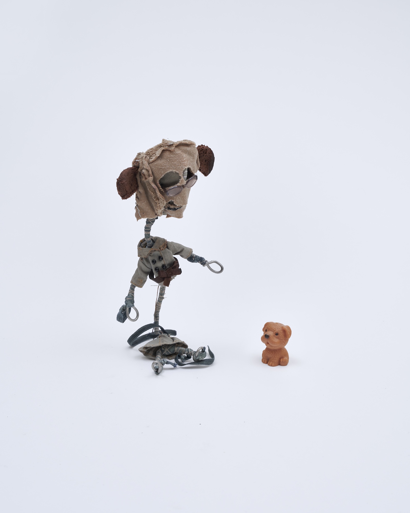 Flower 21, 2026, Wire, cord, thread, pigment, fabric, found objects, dolls, miniatures, 9x18x7cm